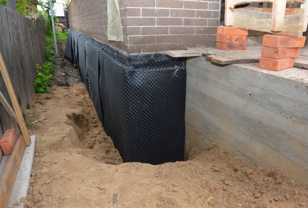 Happy homeowners after waterproofing job in Wantagh